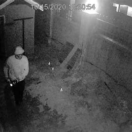 Grainy, low-quality night-time footage from a cheap camera