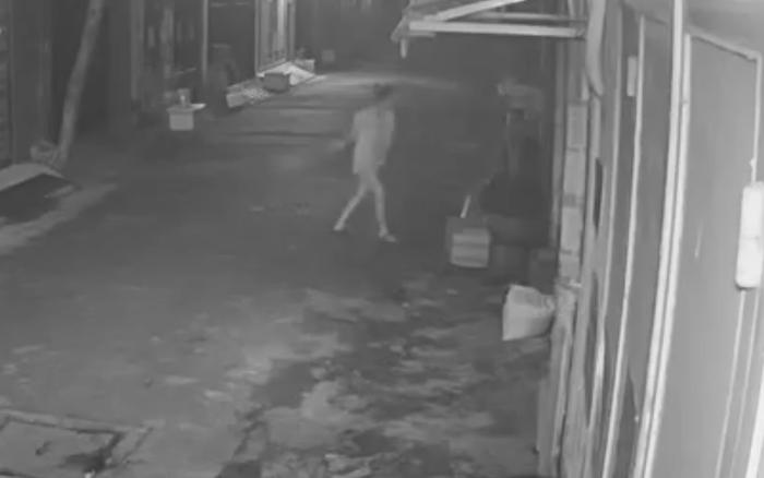 Blurry, low-resolution night-time footage from a cheap camera